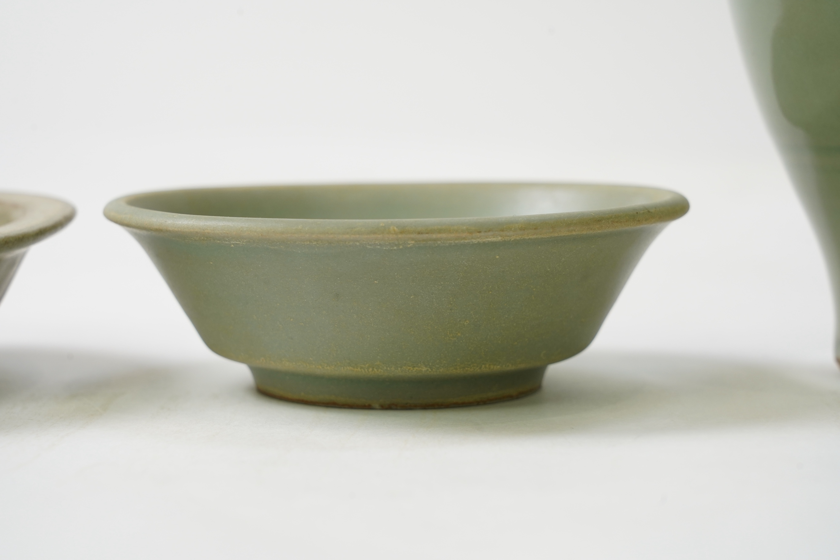 A group of four Chinese Celadon wares - two vases and two dishes, tallest vase 16cm.